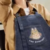SÉRIE OS MONSTROS CAEM NA NATUREZA – Bolsa Avental Jeans